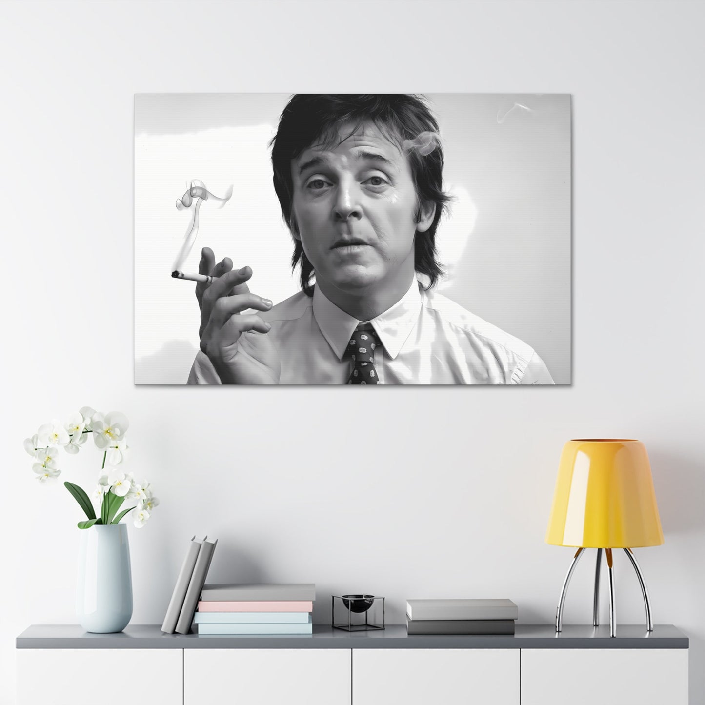 Black and white portrait of featured musician exhaling cigarette smoke, 1960s-inspired decor wall art on canvas.