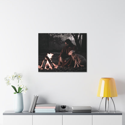 Christian wall art with Jesus and lamb by a campfire in monochrome with orange flame accent.