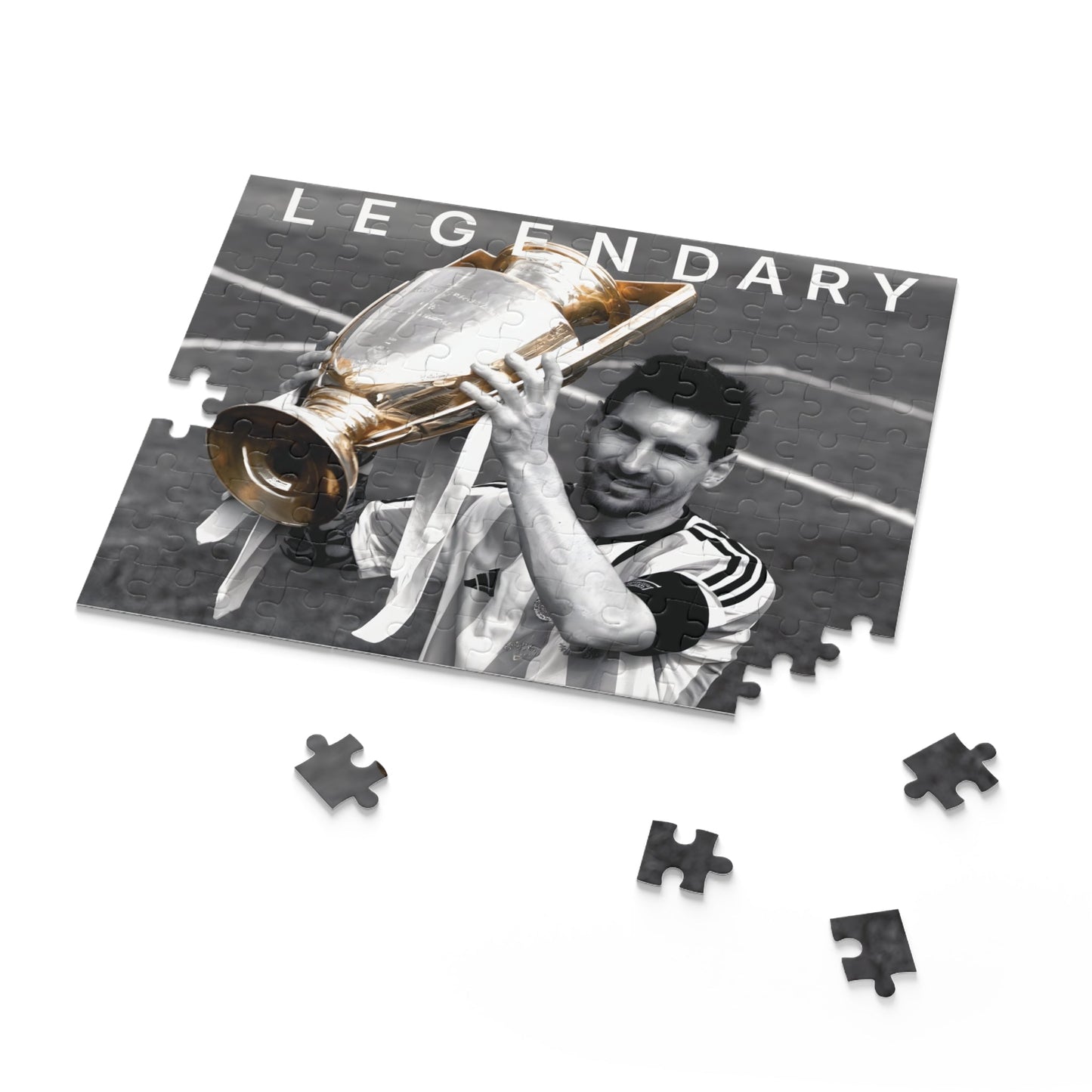 Lionel Messi Soccer Game - Vintage Glory puzzle set with championship trophy image in black and white with color pop.