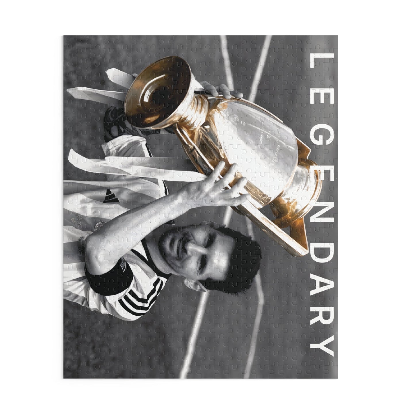 Lionel Messi Soccer Game - Vintage Glory Championship Puzzle featuring Messi with trophy in black and white with color pop.