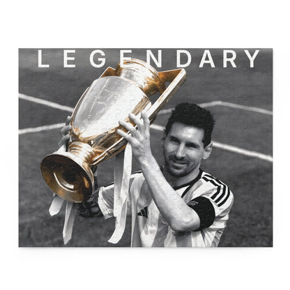 Lionel Messi Soccer Game - holding championship trophy puzzle set featuring 8K black and white image with color pop on uniform, available in 120, 252, and 500 pieces.