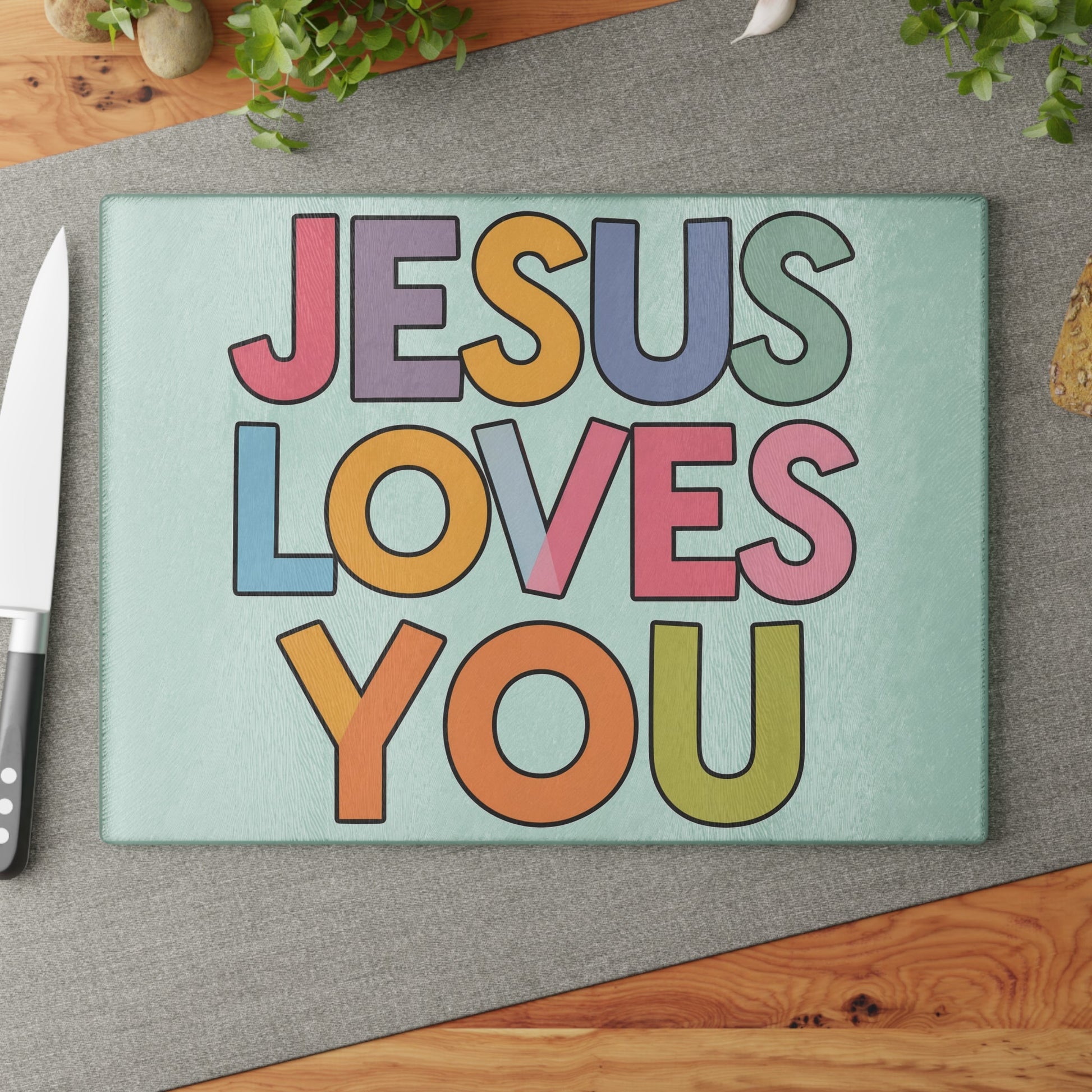 "JESUS LOVES YOU""JESUS LOVES YOU" Inspirational Christian Glass Cutting Board - ChristHome DecorElevate your kitchen with our stunning "JESUS LOVES YOU" glass cutting board. This beautiful and functional piece combines faith and practicality, making it perfect 